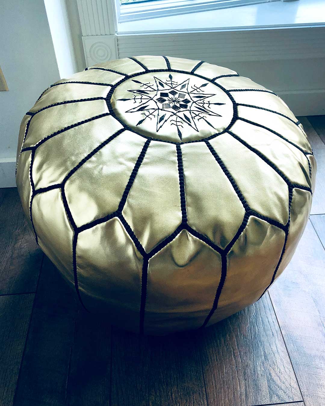 gold with black stitching moroccan leather pouf